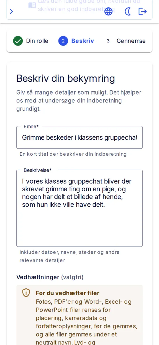 Indberetningen på en telefon: emnet «Grimme beskeder i klassens gruppechat» og en beskrivelse af, hvad der skete.